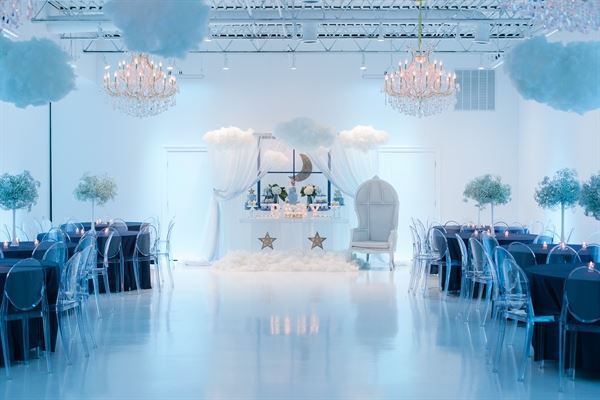All white venue with stunning chandeliers
