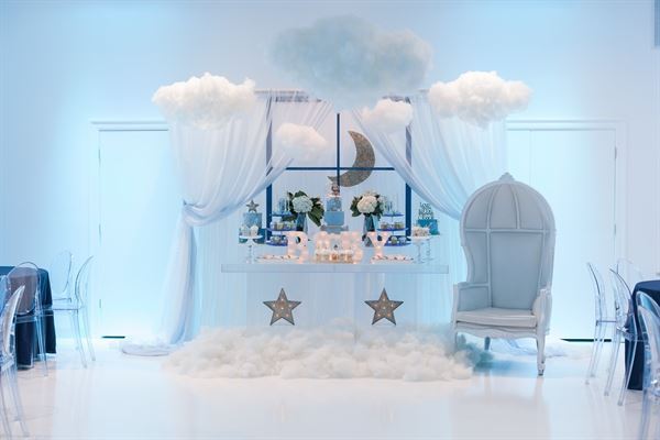 All white venue with stunning chandeliers