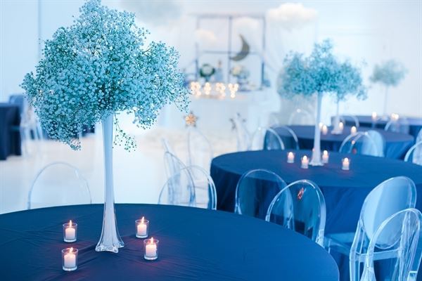 All white venue with stunning chandeliers