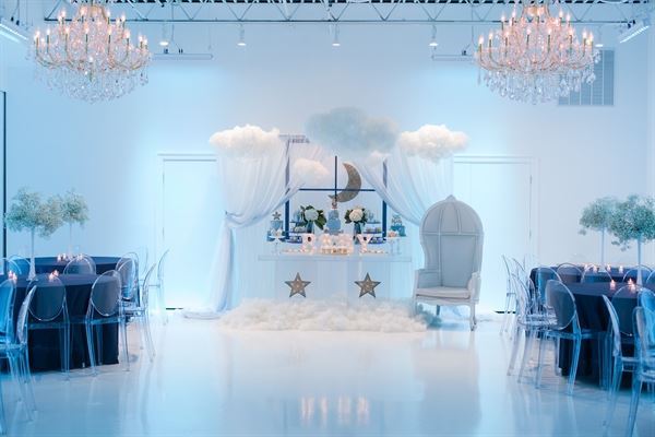 All white venue with stunning chandeliers