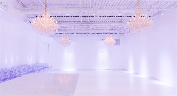 All white venue with stunning chandeliers