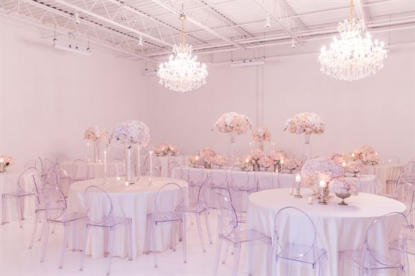 All white venue with stunning chandeliers