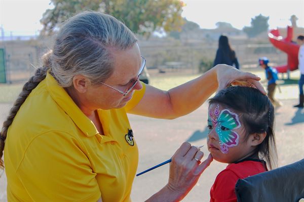 Smiley Orca Face Painting and Natural Henna