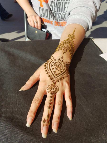 Smiley Orca Face Painting and Natural Henna