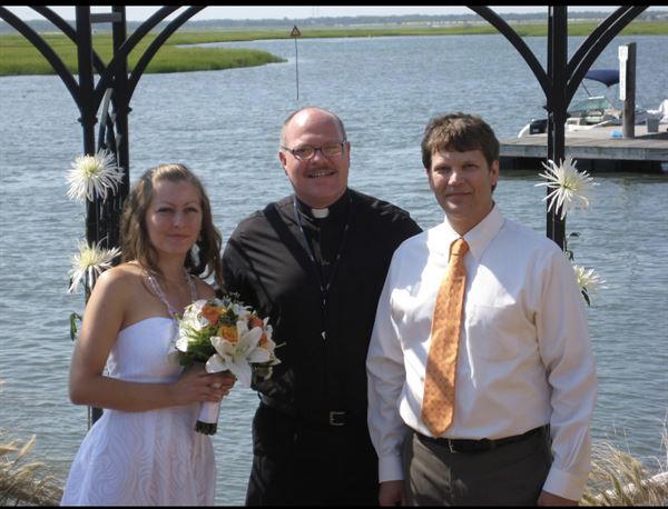 Rev. Fr. Shane E Simar Dr. HC