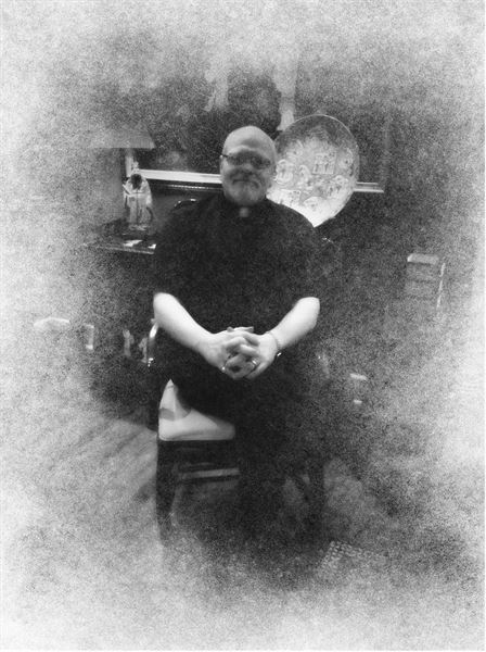 Rev. Fr. Shane E Simar Dr. HC