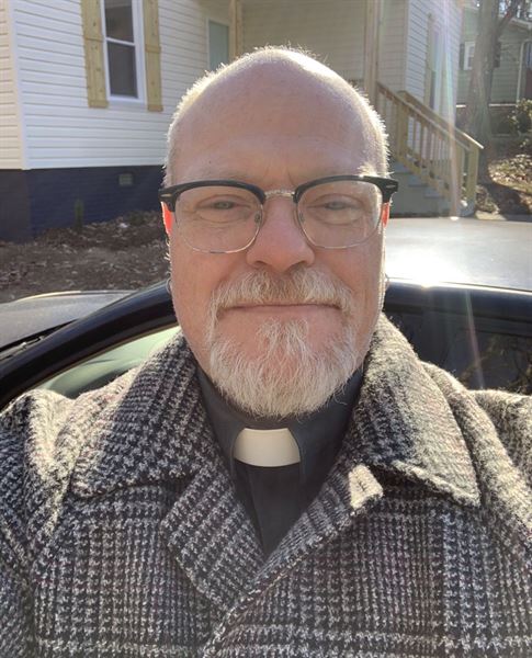 Rev. Fr. Shane E Simar Dr. HC