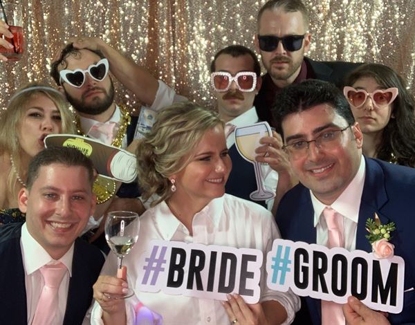 The Phototique Photo Booth and Flower Wall Rental