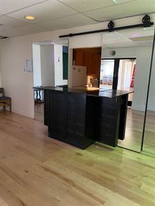 Kitchen with serving area and bar