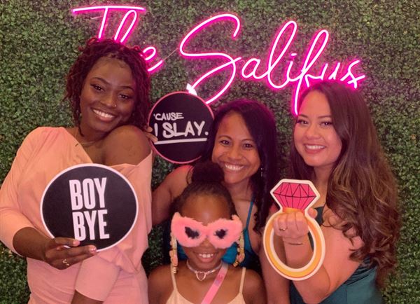 The Phototique Photo Booth and Flower Wall Rental