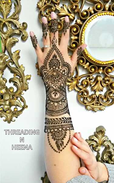 Eyebrow threading and henna tattoo